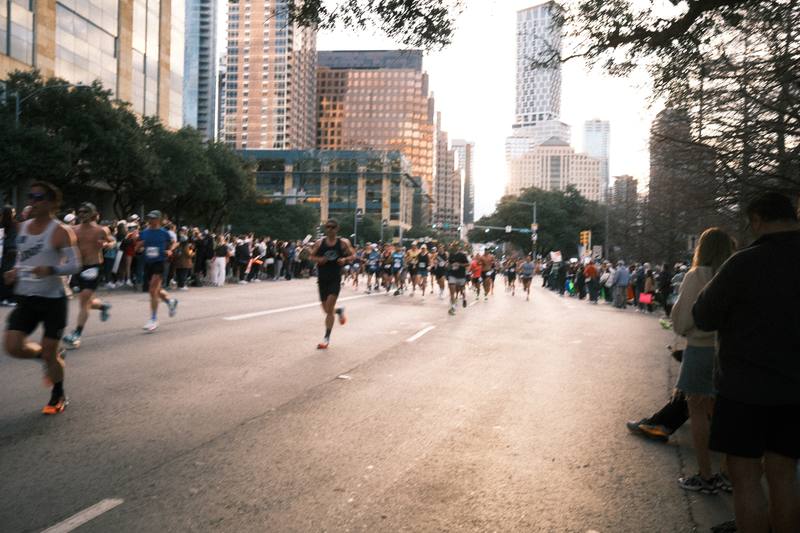 Runners in the Austin Marathon streaming through downtown Austin, Texas